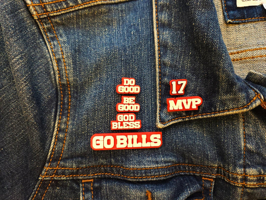 Buffalo Bills 6-pin set pictured on a denim jacket. Pins pictured are white on a red background and say Do Good Be Good God Bless Go Bills #17 MVP in honor of Buffalo Bills Josh Allen's MVP performance.