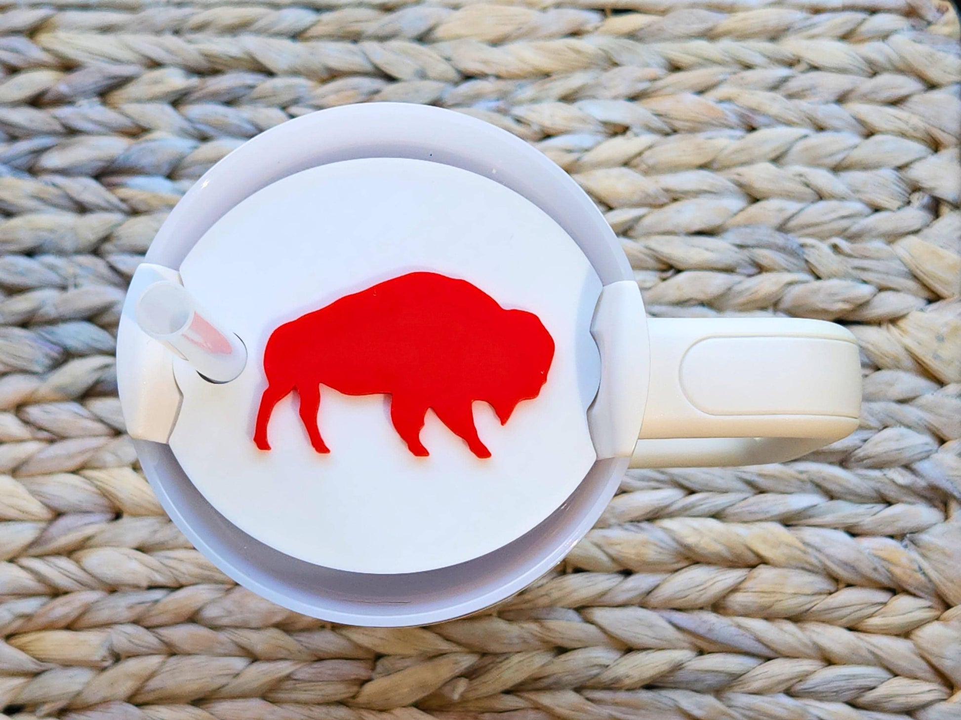 Red buffalo silhouette topper fitted on a white Stanley 40 oz tumbler, showing the bold Buffalo-inspired design for football fans.