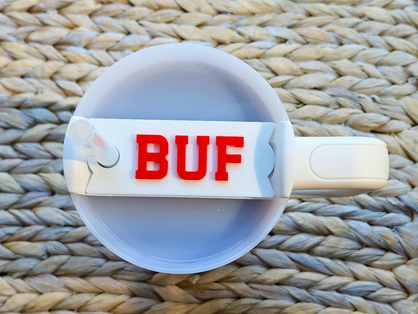 Minimal white Stanley cup topper with bright red BUF lettering, fitted on a 40 oz Stanley tumbler, perfect for Buffalo fans.