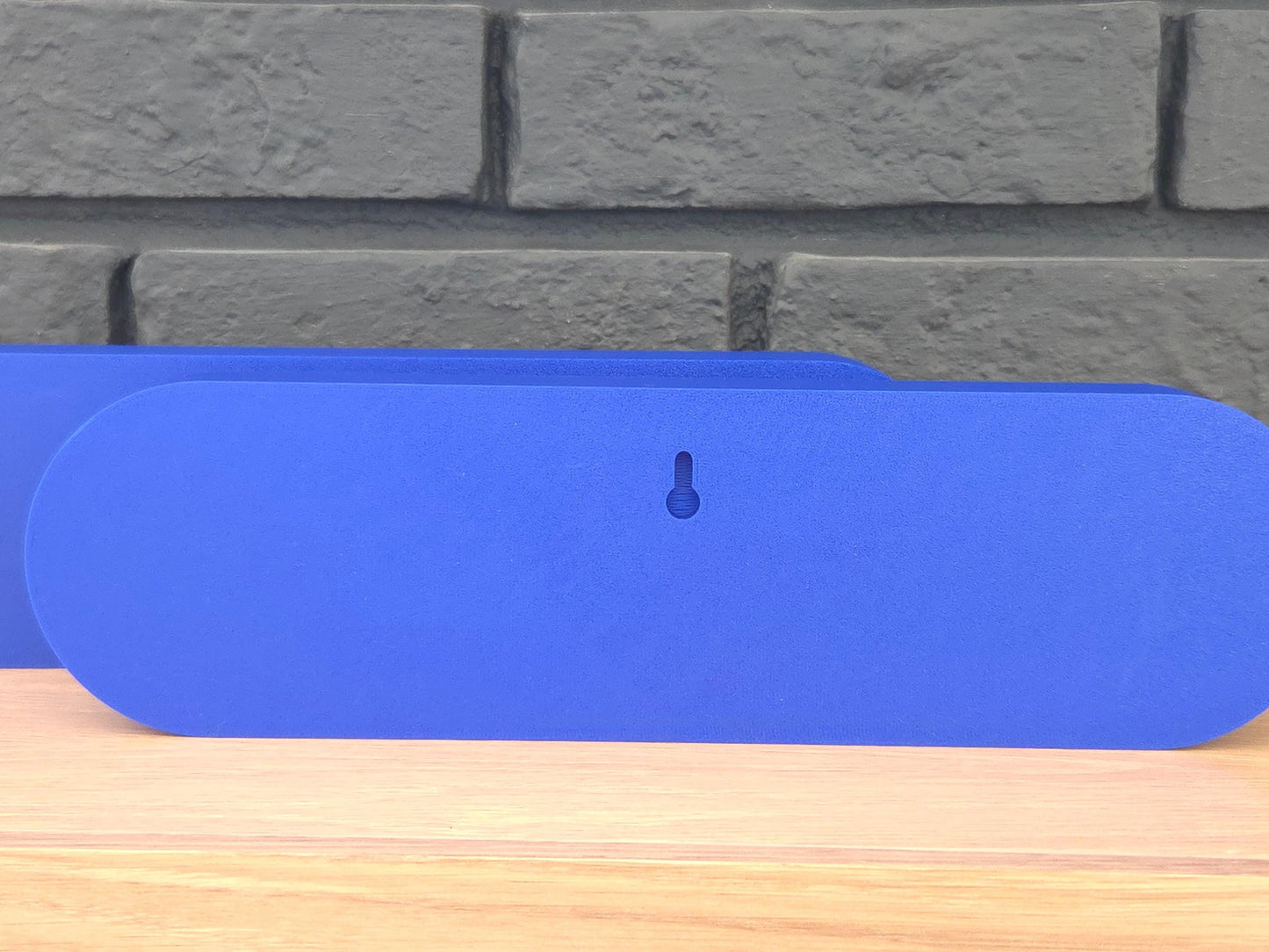 Back of 3D printed Let's Go Buffalo sign showing keyhole wall mount — easy to hang. Hardware not included.