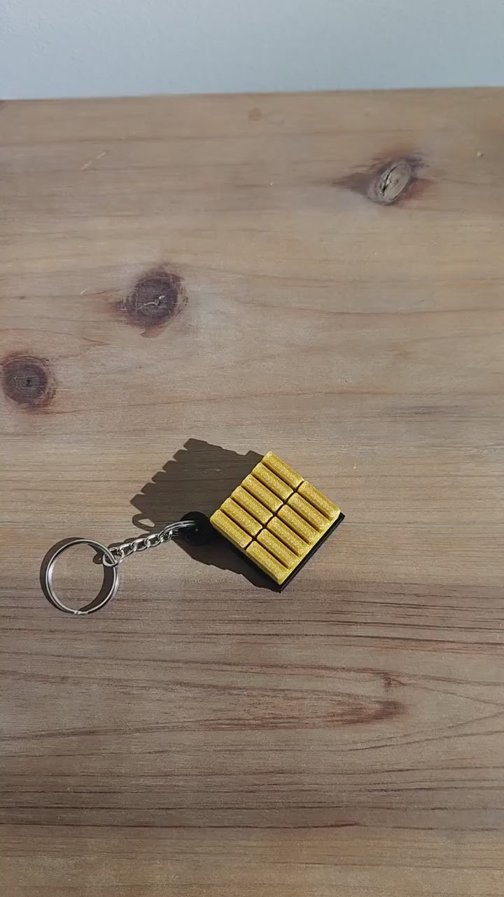 Battle Royale-Inspired Clicky Fidget Keychain | Gold Bar Clicking Gamer Keychain | Video Game Inspired Gift Ideas