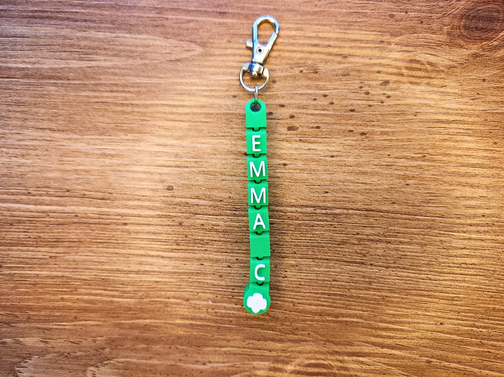 Green keychain with the name Emma - great gift for a girl scout!