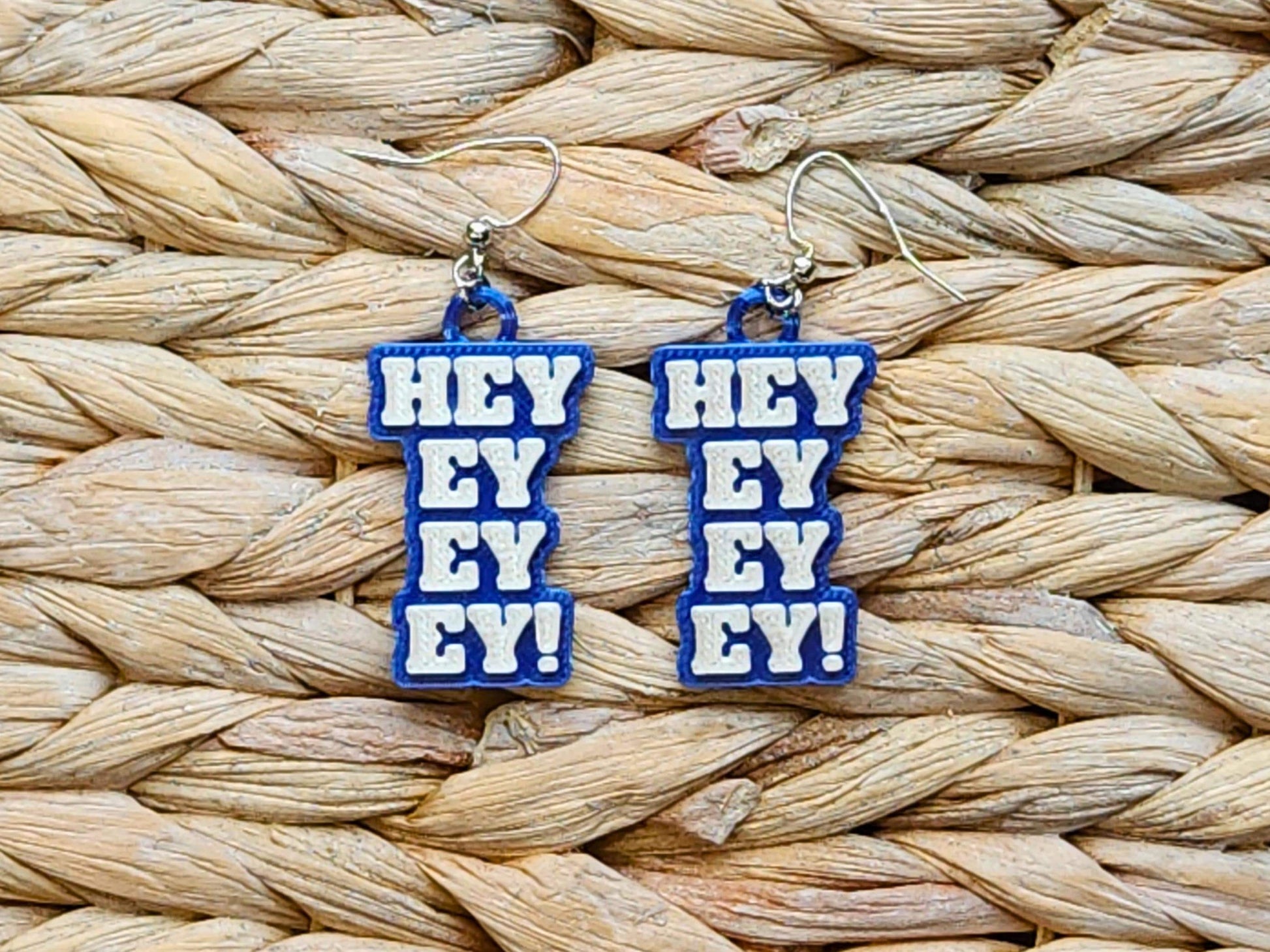 Buffalo Bills blue 3D printed earrings with white “Hey Ey Ey Ey” text – fun and bold NFL supporter earrings for spirited fans.