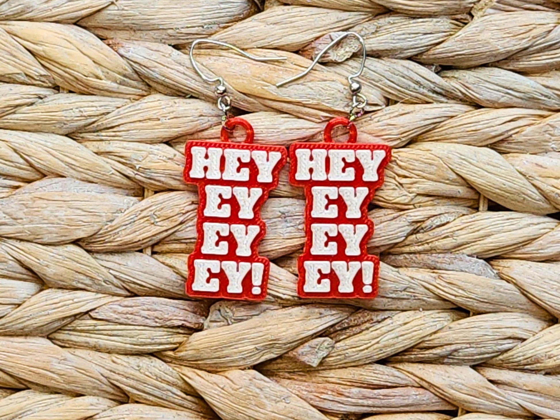 Close-up of red “Hey Ey Ey Ey” earrings for Bills Mafia – handmade sports fan jewelry for NFL lovers, great Buffalo football gift.