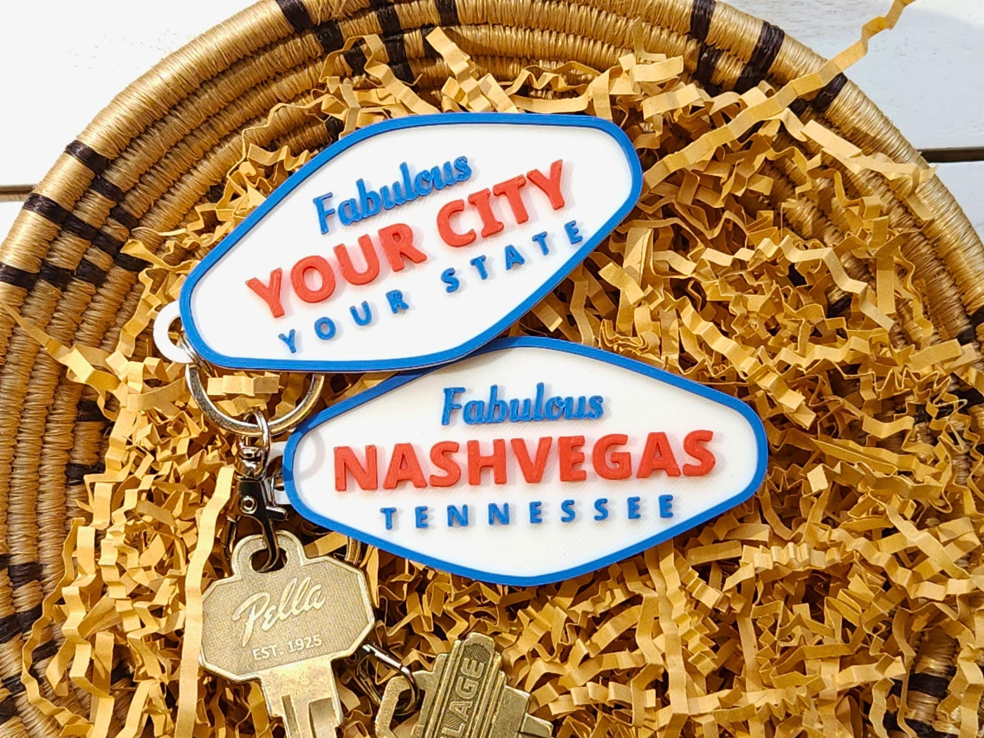 3D printed personalized city and state keychain with Nashvegas, Tennessee design on kraft paper gift filler in basket tray