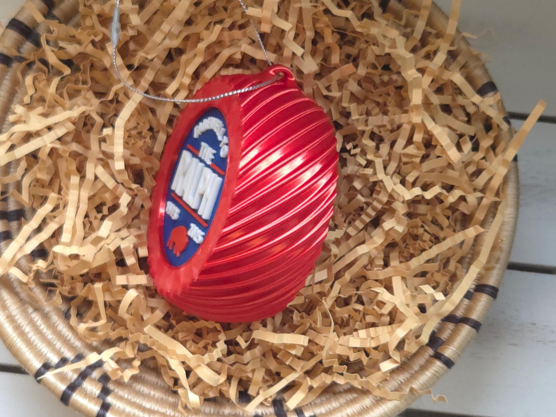 The side of the Limited edition buffalo football Christmas ornament is displayed, highlighting festive design.