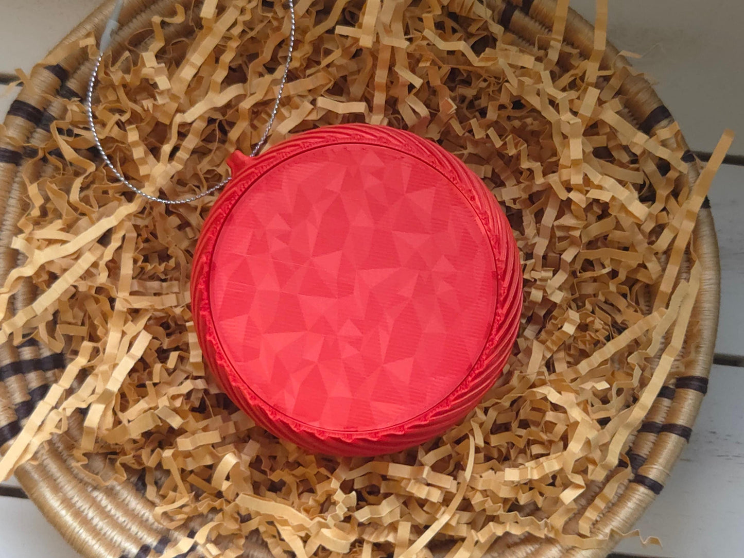 The back of the Limited edition buffalo football Christmas ornament is displayed, highlighting a sparkle background in red.