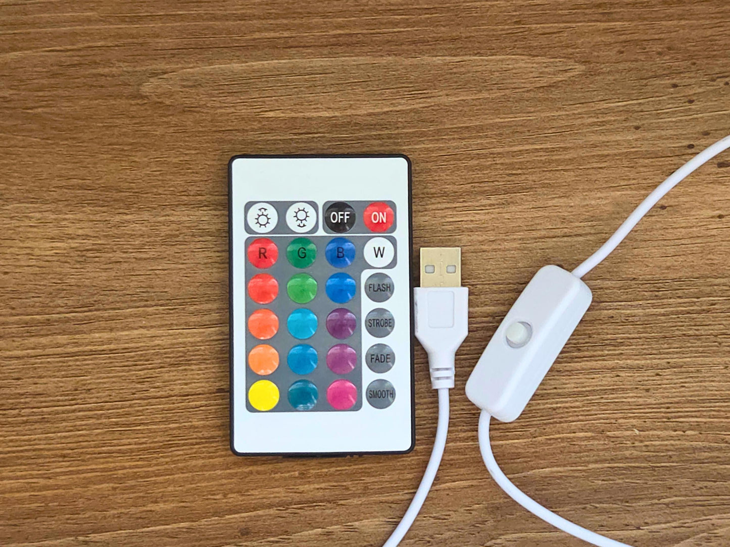 The remote of the lamp is shown featuring 12 colors, with the 4.5 foot cord and USB adapter.
