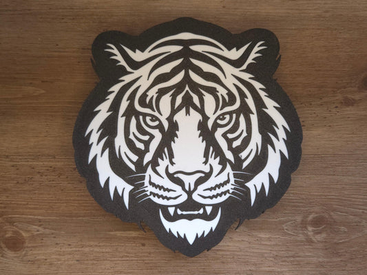 The front of the lamp is pictured on a wooden background. The lamp is black and white and features a tiger mascot.